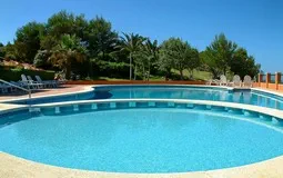 Garden Apartment in Port Adriano - Pool with landscaping & port views