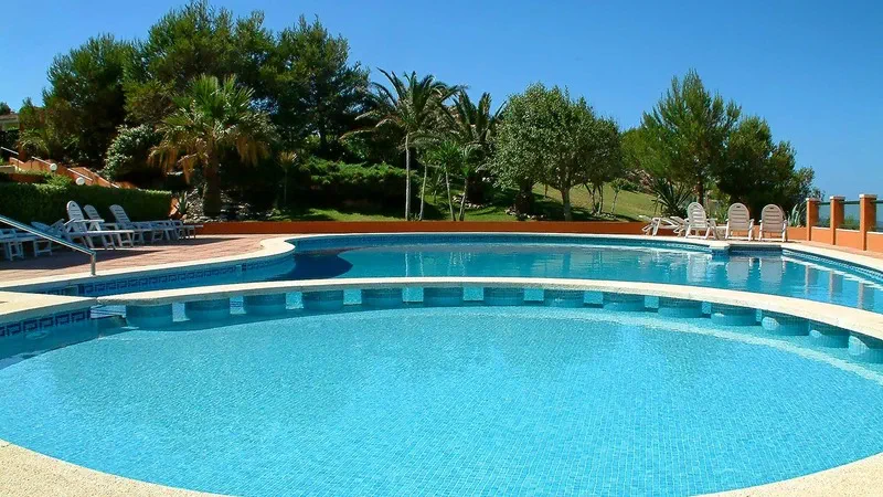 Garden Apartment in Port Adriano - Pool with landscaping & port views