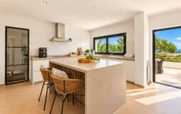 Villa in El Toro - Port Adriano - Sunlit Modern Kitchen with Terrace Views.jpg